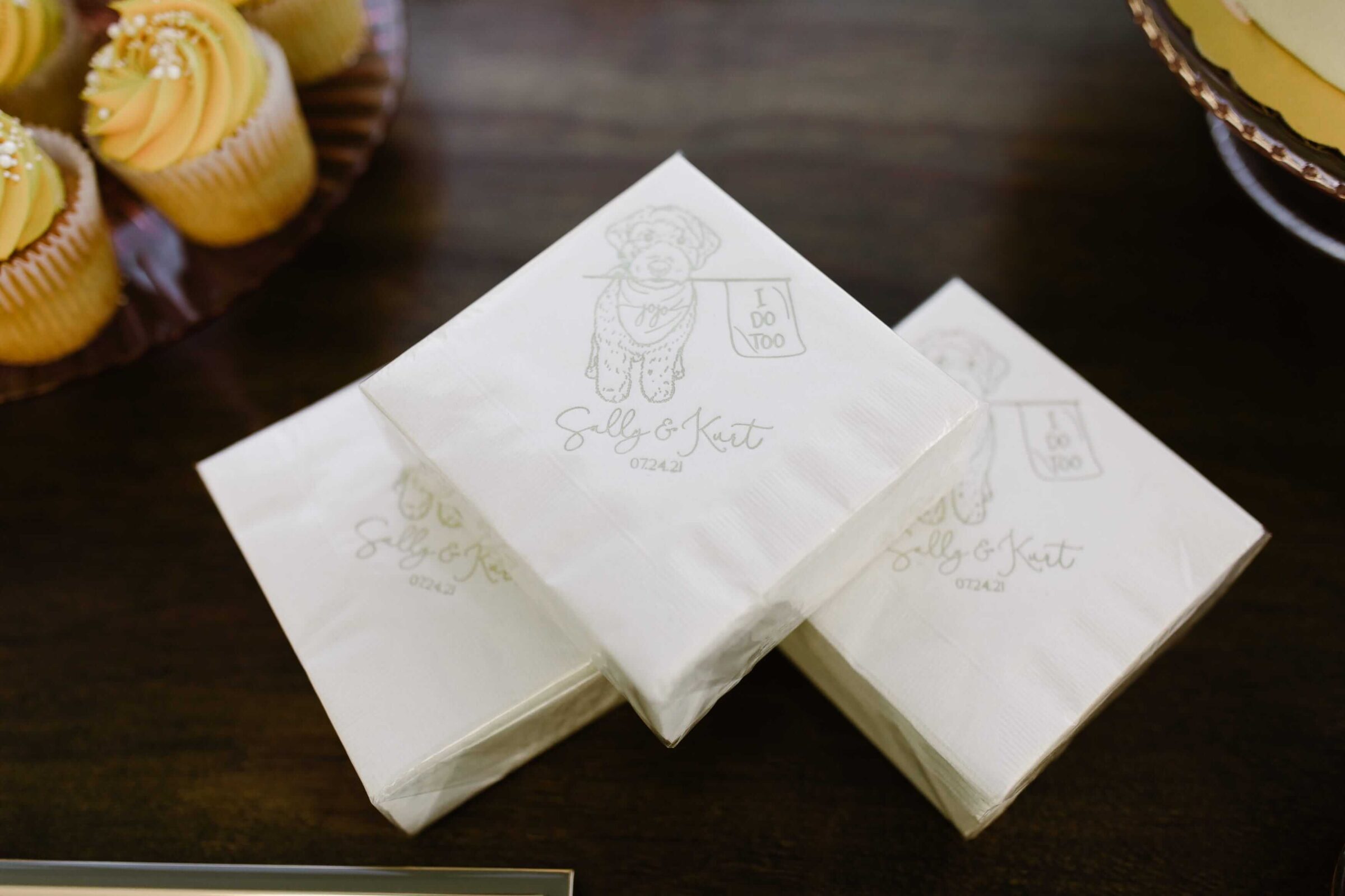 Custom wedding napkins with dog illustration and names.