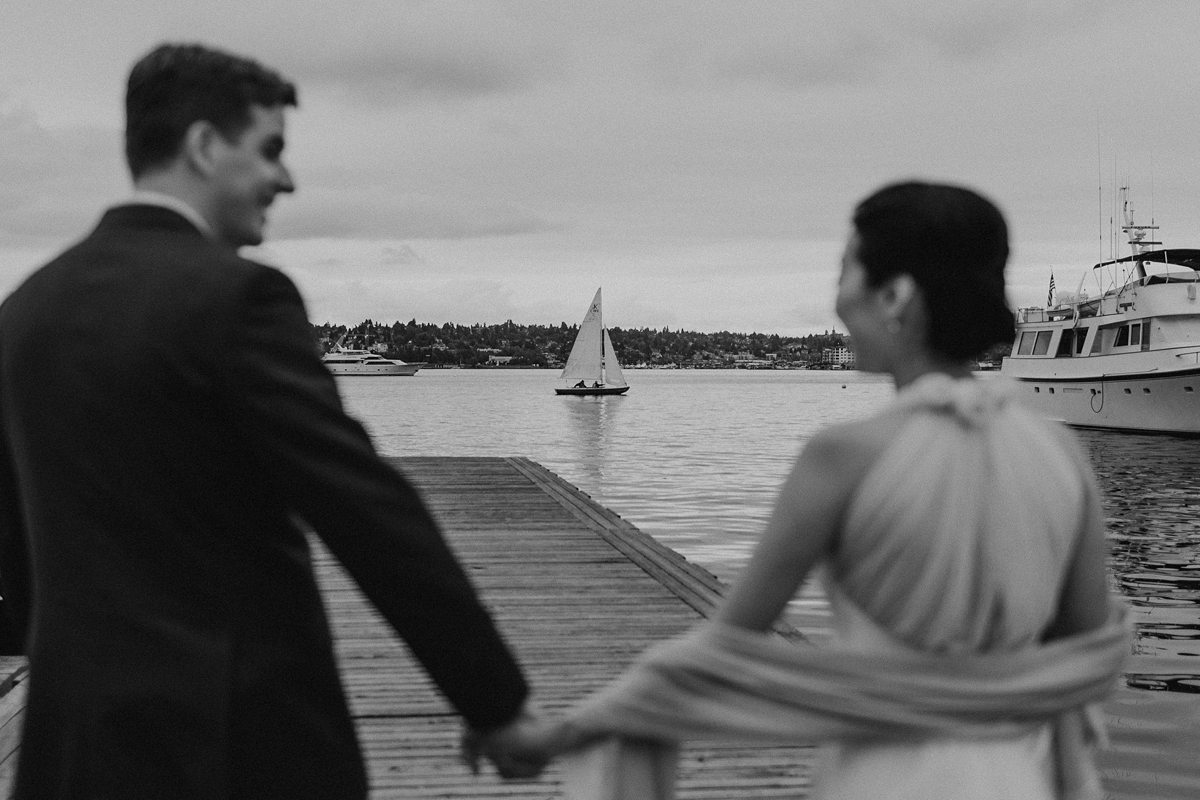 Couple walking on dock in Seattle waterfront