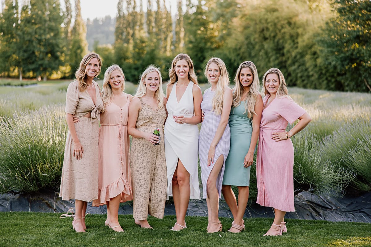 Friends of bride standing in a field at seattle wedding venue